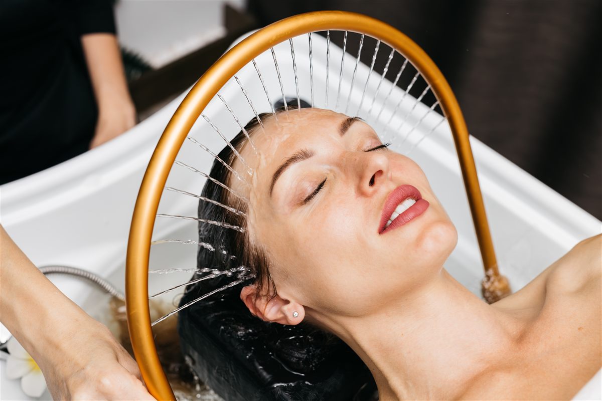 Woman receiving a Japanese head spa treatment